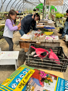 Summer Camp participants learning flower pounding at Loma Vista Farm