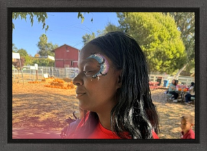 showing off her face painting