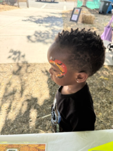 proudly displaying his face art